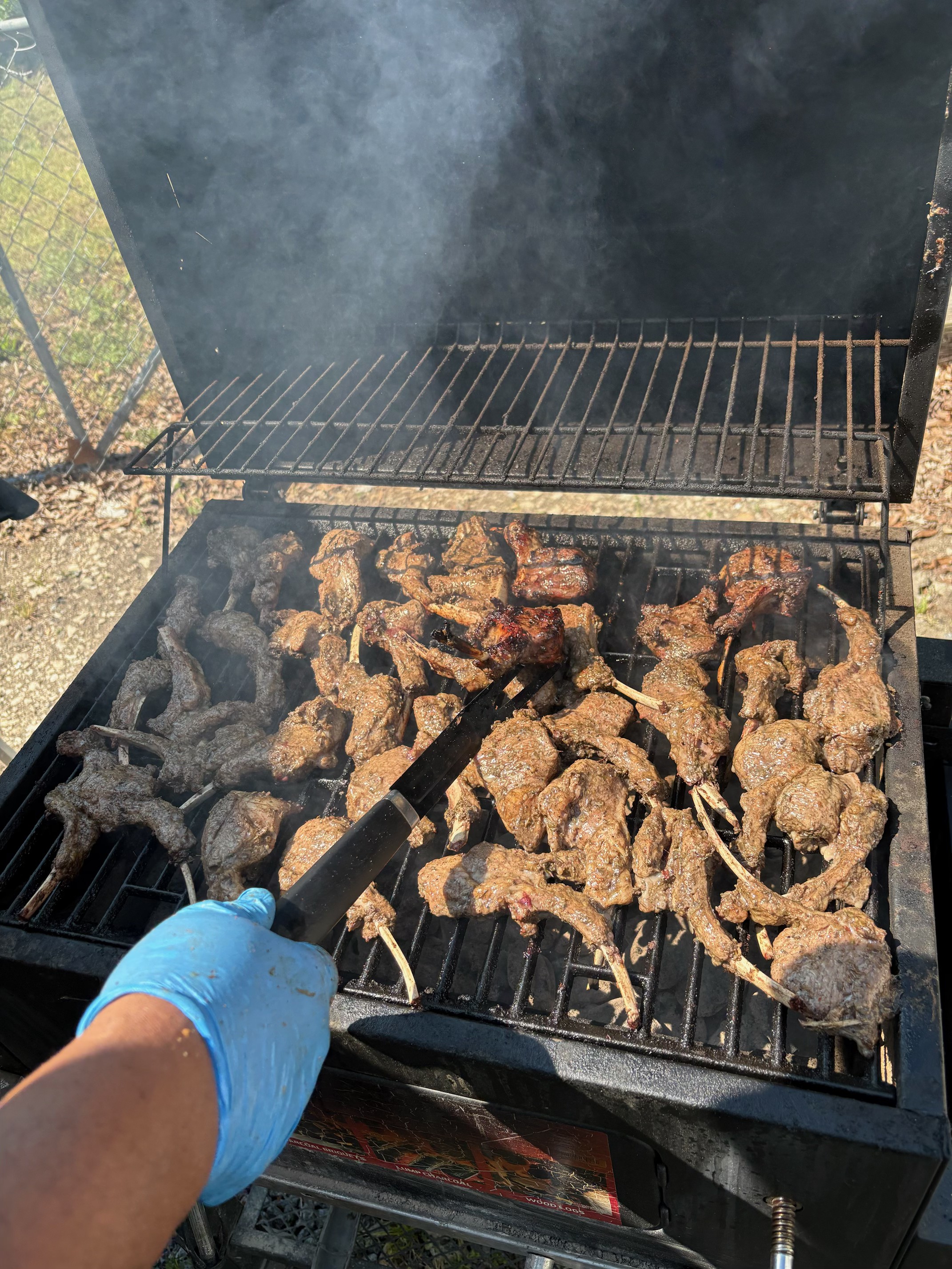 Steak grilling over smoke on the Hibachi 803 grill