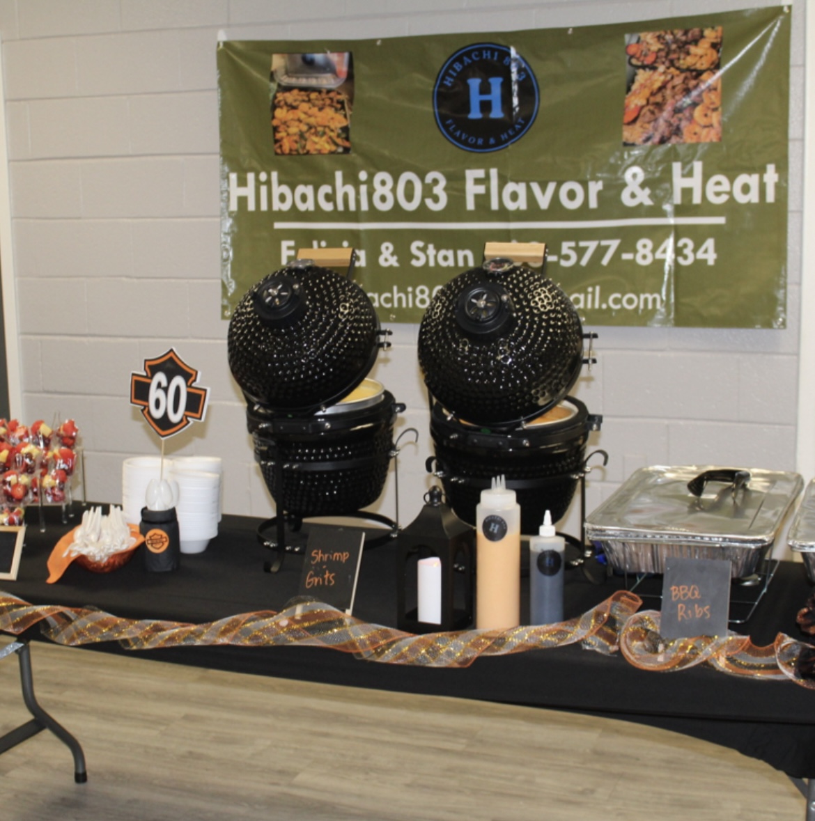Full Hibachi 803 catering setup with grills and banner